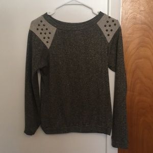 Studded sweater. From buckle.